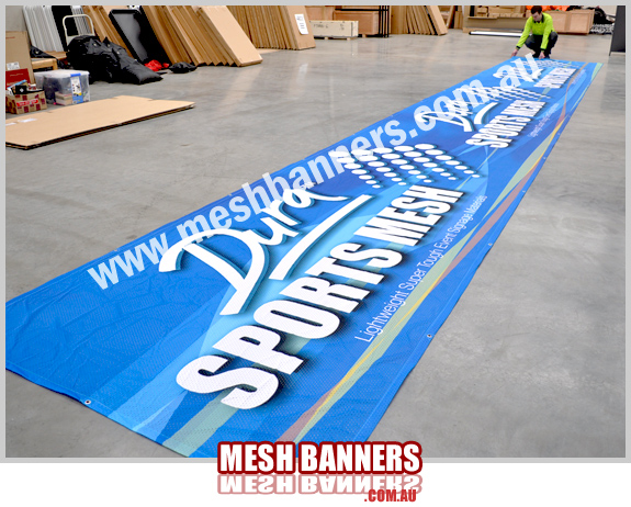 Here the mesh banner roll is lying flat. This mesh banner sign material is the best, it is lightweight, colorful and super strong