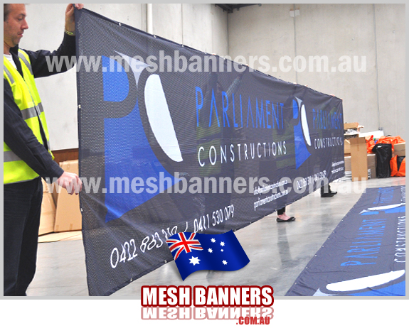 Printed long fencing chainlink privacy screens for construction. Parliment constructions choose mesh banners to surround the construction site.