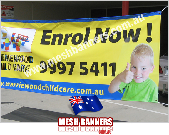 Outdoor banner sign with a childs 'thumbs up'
