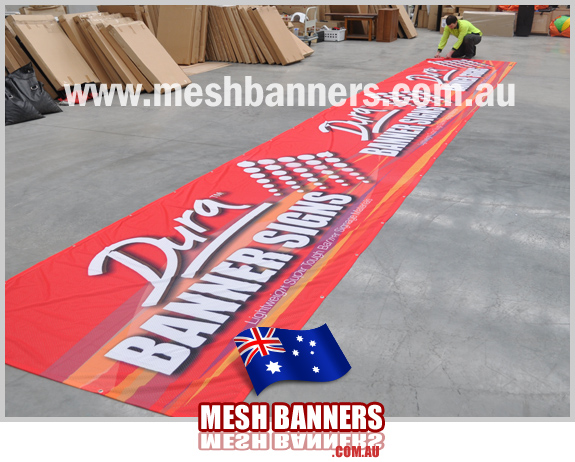 Man checking banner sign tolerance and final quality