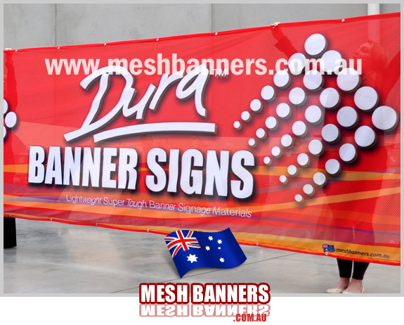 Holding up a large banner sign